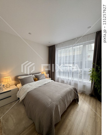 a modern bedroom in a stylish interior of a new apartment with designer renovation a modern bedroom in a stylish interior of a new apartment with designer renovation 131257627