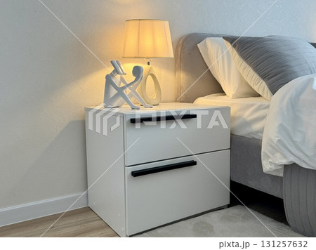 A white bedside table for a modern and stylish interior in a new apartment 131257632