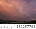 夕焼け空と橋のシルエットに浮かぶ半月の風景 131257798