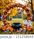 A frame consisting of a garland of Halloween elements: pumpkins, a black cauldron, skulls, cobwebs and spiders, bats, and cheerful ghosts 131258044