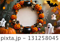 A frame consisting of a garland of Halloween elements: pumpkins, a black cauldron, skulls, cobwebs and spiders, bats, and cheerful ghosts 131258045