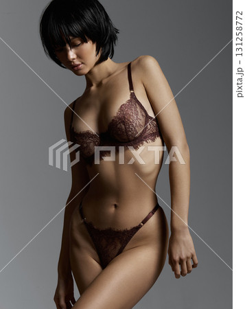 Beautiful young woman in underwear. tanned skin body Beautiful young woman in underwear. tanned skin body 131258772