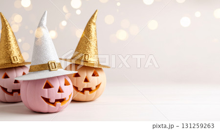Three stylish pastel Halloween pumpkins wearing sparkly gold and silver witch hats, with bright bokeh. Three stylish pastel Halloween pumpkins wearing sparkly gold and silver witch hats, with bright bokeh. 131259263