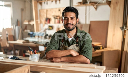 Carpenter working in a workshop showcasing skills and creativity with wood 131259302