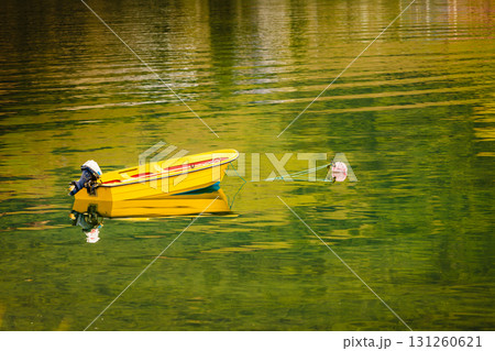 Little boat on water surface Little boat on water surface 131260621