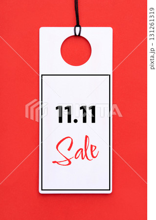 11.11 single day sale concept. White tag on red background 11.11 single day sale concept. White tag on red background 131261319