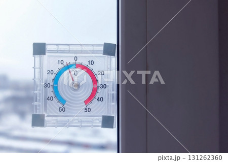 Thermometer on the window with negative temperature in winter. Thermometer on the window with negative temperature in winter. 131262360