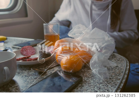 Products on the table in the second-class train carriage. 131262385
