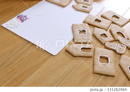 Details for gingerbread houses on the table. Cooking homemade gingerbread house. Details for gingerbread houses on the table. Cooking homemade gingerbread house. 131262984