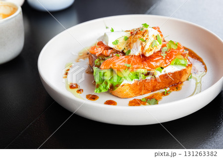 A gourmet open-faced toast features smoked salmon and creamy cheese A gourmet open-faced toast features smoked salmon and creamy cheese 131263382