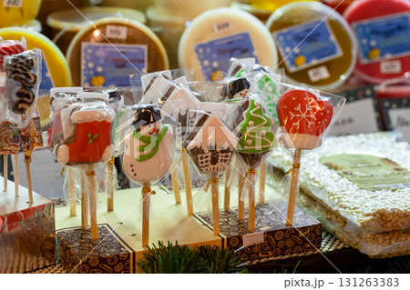 Vibrant holiday treats on sticks including snowman, christmas tree, and house Vibrant holiday treats on sticks including snowman, christmas tree, and house 131263383