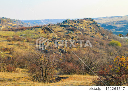 Scenic view of rocky hills, meadow and trees at autumn 131265247