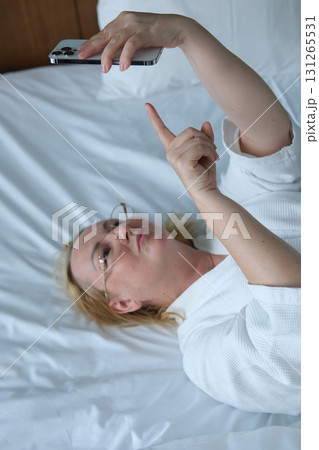 Senior adult woman waking up in the morning taking and wearing optical glasses. Old grandmother having bad weak sight, elderly vision problem. Visually impaired elder person concept. Close up view 131265531