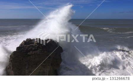 High waves breaking on rocks of coastline High waves breaking on rocks of coastline 131266678