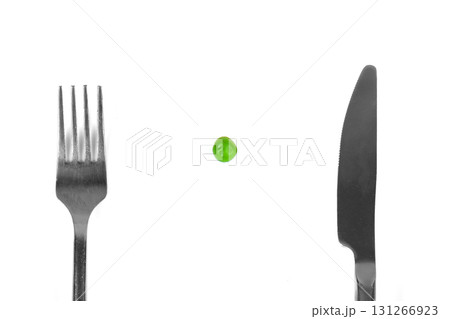 Pea meal with silver cutlery 131266923