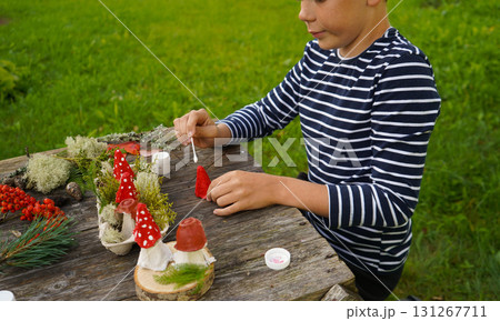 Creative reuse of paper and natural materials in kids crafts that celebrate childhood wonder. 131267711