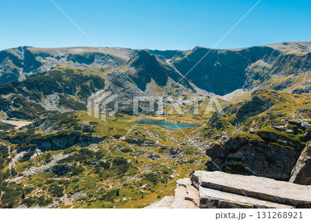 Mountain view of the Rila Mountains in Bulgaria. Seven Rila Lake hike. Eco trails. Connection with nature.	 131268921