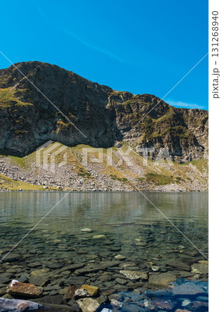 Mountain view of the Rila Mountains in Bulgaria. Seven Rila Lake hike. Eco trails. Connection with nature.	 131268940