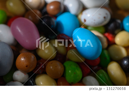 Colorful assortment of candy-coated chocolate eggs on a spring afternoon Colorful assortment of candy-coated chocolate eggs on a spring afternoon 131270038