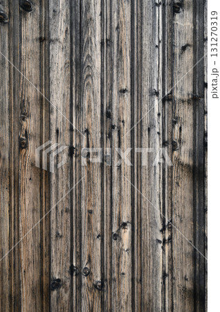Rustic wooden texture showcasing rich grains and a weathered appearance in natural light Rustic wooden texture showcasing rich grains and a weathered appearance in natural light 131270319