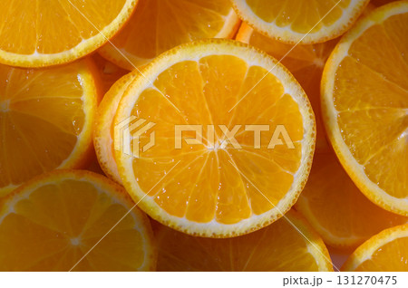 Vibrant orange slices arranged beautifully, showcasing juicy texture freshness Vibrant orange slices arranged beautifully, showcasing juicy texture freshness 131270475