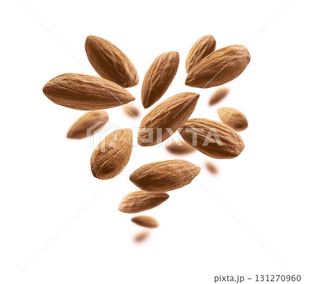 Almond nuts levitate on a white background Almond nuts levitate on a white background 131270960