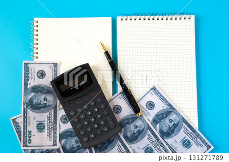 Bank note on book note and calculater,Business concept. Bank note on book note and calculater,Business concept. 131271789