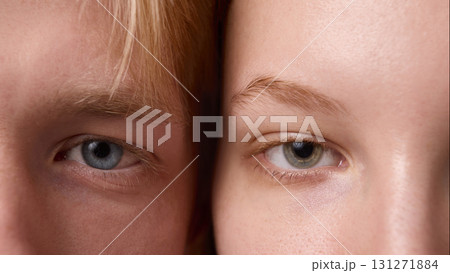 Extreme close up of male and female eyes with natural skin and clear detail 131271884