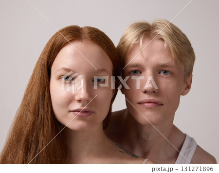 Close up portrait of young couple with natural bare faces on clean background Close up portrait of young couple with natural bare faces on clean background 131271896
