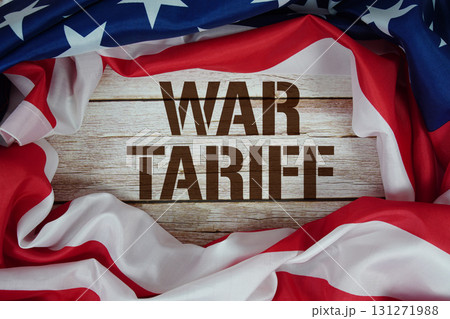 American flag with "War Tariff" on wooden background 131271988