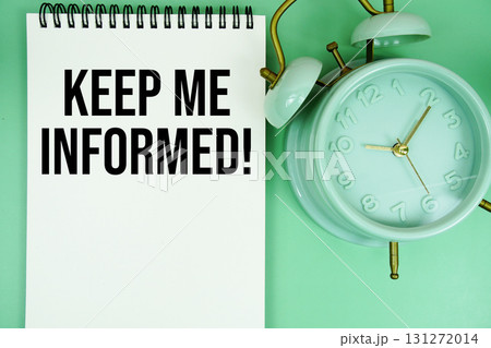 Keep Me Informed! text with alarm clock flat lay on green background 131272014