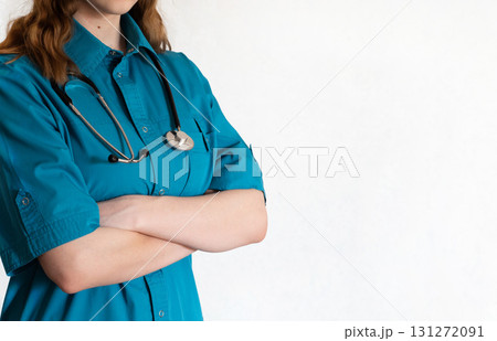 Medical professional examining stethoscope in a clinical setting during daytime Medical professional examining stethoscope in a clinical setting during daytime 131272091