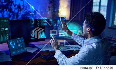 Man in smart glasses interacts with futuristic data dashboards and AI analytics interface. Collage 131272236