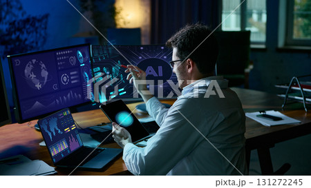 Professional interacting with AI-driven data visualization interface in modern workspace. Collage 131272245