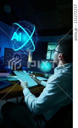 Business analyst reviewing AI hologram in futuristic office. Collage 131272257