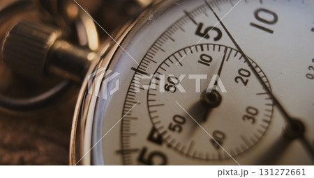 Macro Close Up Shot of Mechanical Stopwatch with Metallic Case and Clear Dial with Running Second Hand Macro Close Up Shot of Mechanical Stopwatch with Metallic Case and Clear Dial with Running Second Hand 131272661