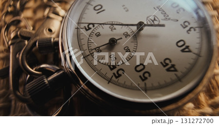 Macro Close Up Shot of Mechanical Stopwatch with Metallic Case and Dial with Running Second Hand Macro Close Up Shot of Mechanical Stopwatch with Metallic Case and Dial with Running Second Hand 131272700