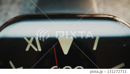 Macro Close Up of Modern Digital Wristwatch with Roman Numerals Showing Precise Time Macro Close Up of Modern Digital Wristwatch with Roman Numerals Showing Precise Time 131272711