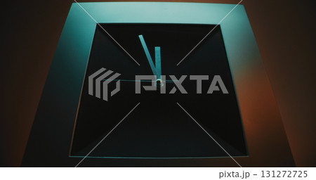 Close Up of Square Wall Clock with Futuristic Design on Pink Background 131272725