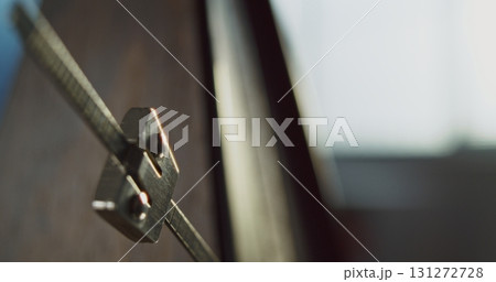 Close Up of Classic Wooden Metronome with Swinging Pendulum. Slow Motion 131272728