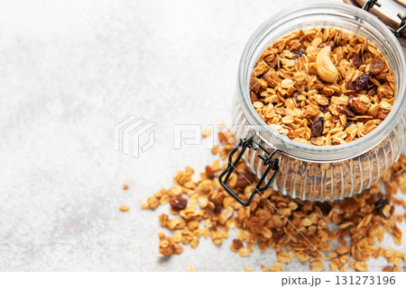 Granola cereal in glass jar for healthy breakfast 131273196