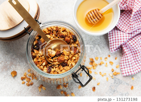Granola with nuts and dried fruits in jar 131273198