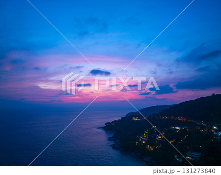 aerial view sweet pink Sunset is accompanied by clouds floating over the sea. 131273840