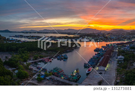 Aerial view of Vibrant Sunset Over Coastal Fishing harbor Aerial view of Vibrant Sunset Over Coastal Fishing harbor 131273881