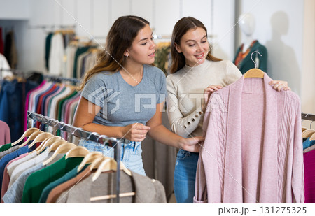 Woman with personal shopper shopping in store Woman with personal shopper shopping in store 131275325