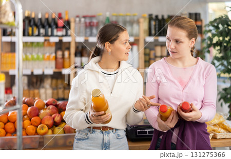 Two customers choose natural juices Two customers choose natural juices 131275366