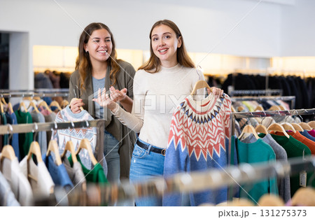 Two women shopping warm clothes in store Two women shopping warm clothes in store 131275373