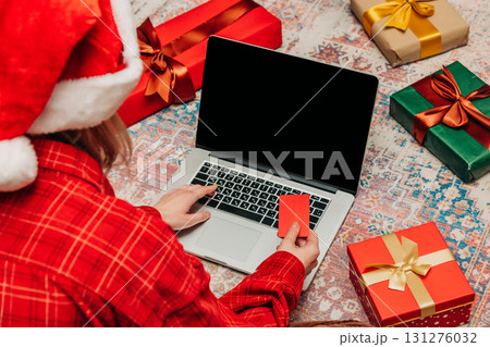 woman searches for Christmas presents online 131276032