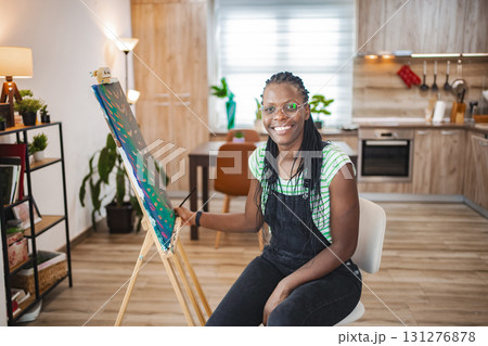 Creative artist at work in a stylish home studio setting 131276878