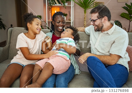 Family joy in a cozy living room on a sunny afternoon 131276898